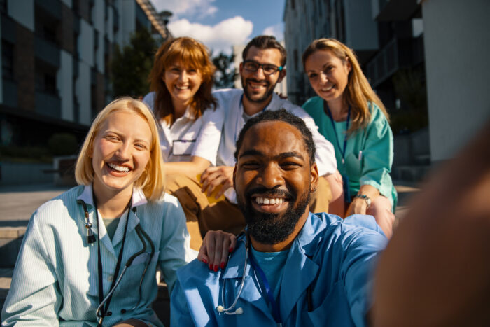 Medical staff posing and smiling.