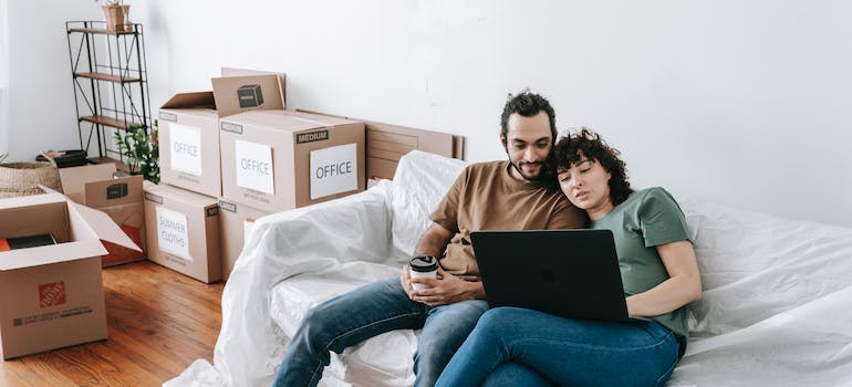 A young couple looking for Sterling interstate movers online