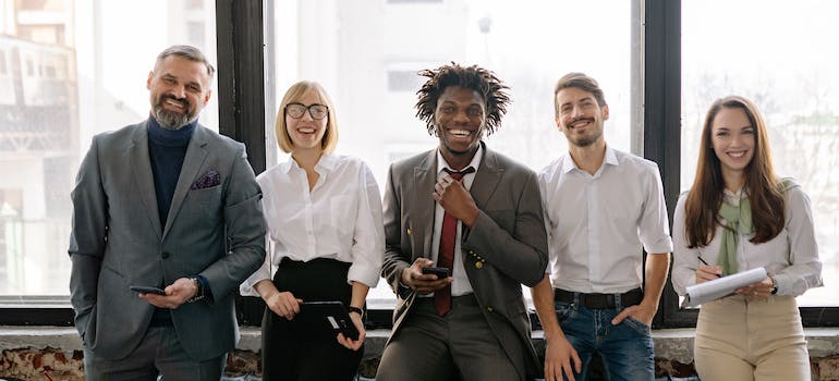 A happy group of workers building a global mobility program