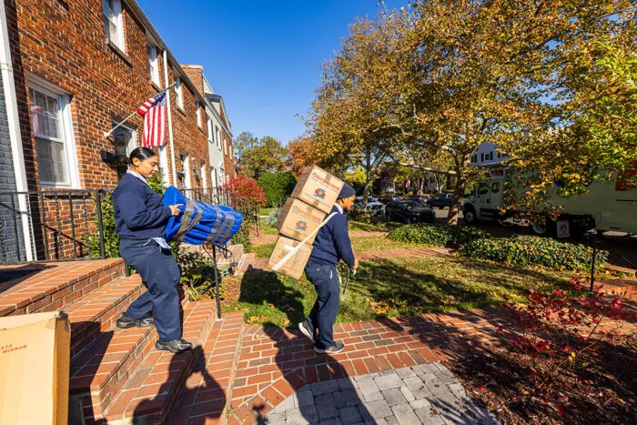 movers carrying boxes 