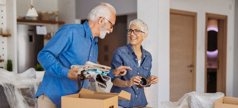 an elderly couple laughing 