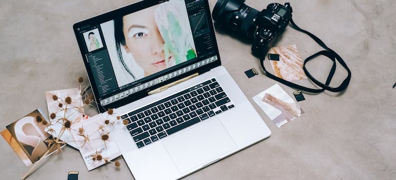 digital camera next to a laptop.