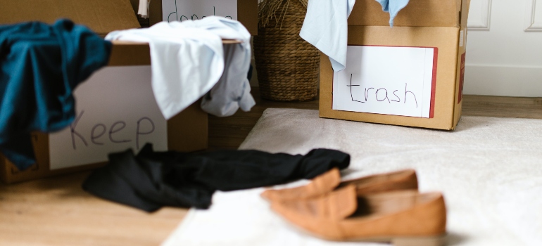 Pile of discarded clothes in boxes 