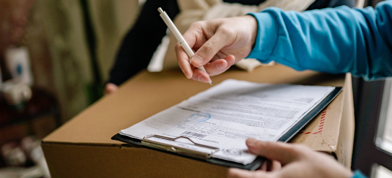 Person signing shipping documents