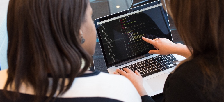 Two women coding