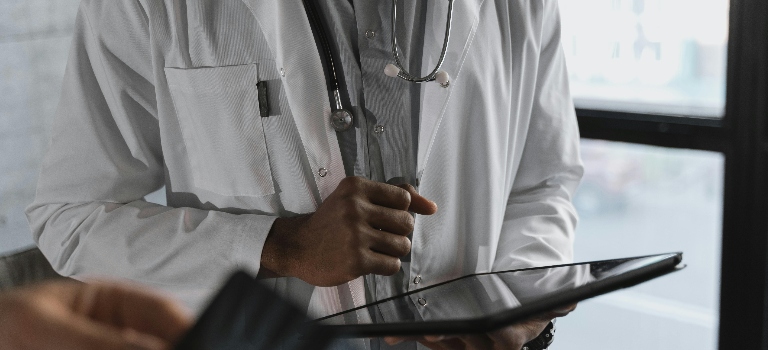 a doctor holding a tablet 