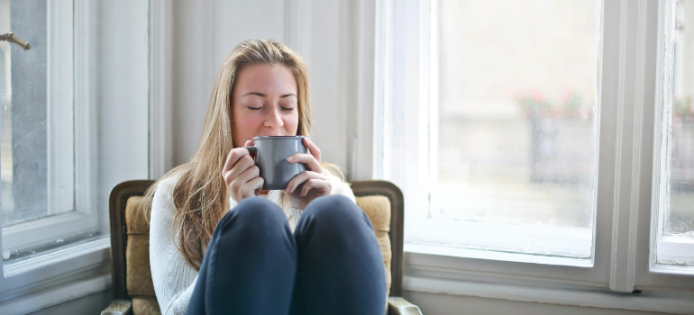 a woman relaxing with a cup of coffee 