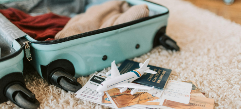 passport and a bag on the floor 