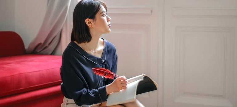 a girl writing in a book