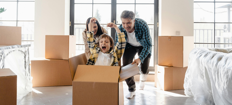 family packing for a move while playing fun packing games for kids on moving day