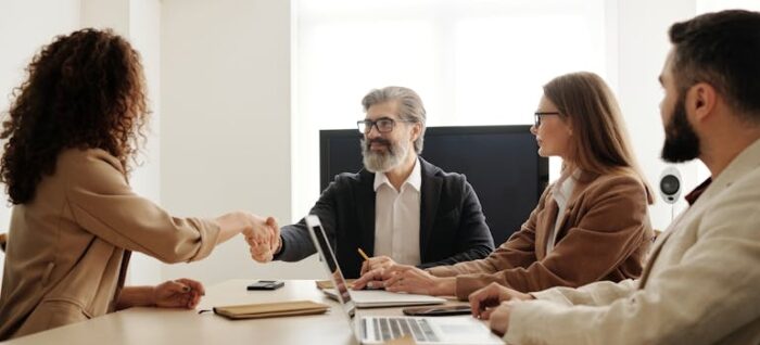 HR professionals talking with the employee about the role of human resources in global mobility.