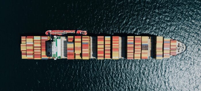 Directly Above a Fully Loaded Cargo Ship on a Sea shipping for a U.S. Government client