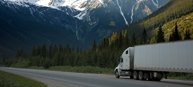 Moving truck driving on a highway.