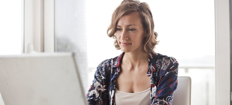 Woman scheduling a move with our movers in Laurel on a laptop.