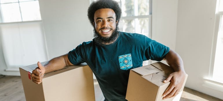 One of our movers in Gaithersburg holding boxes.