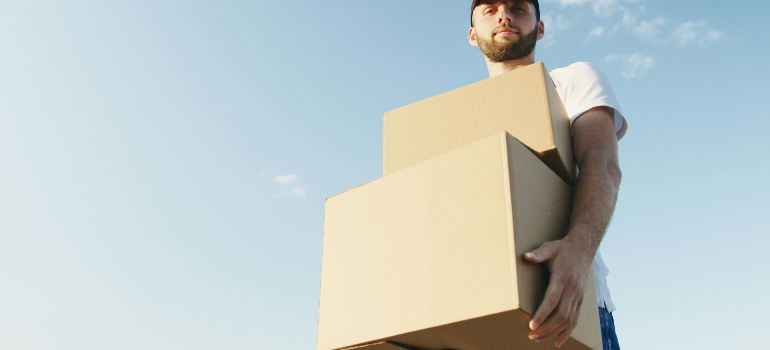 a man with a box from our team of movers in Middleburg