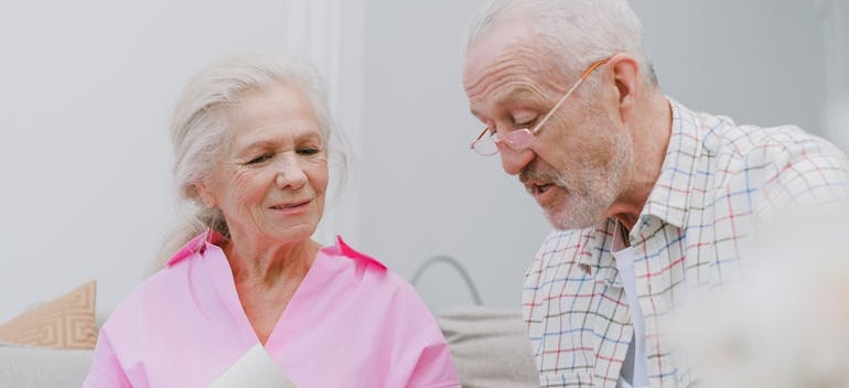 A Couple with Gray Hair Looking at Photos Together