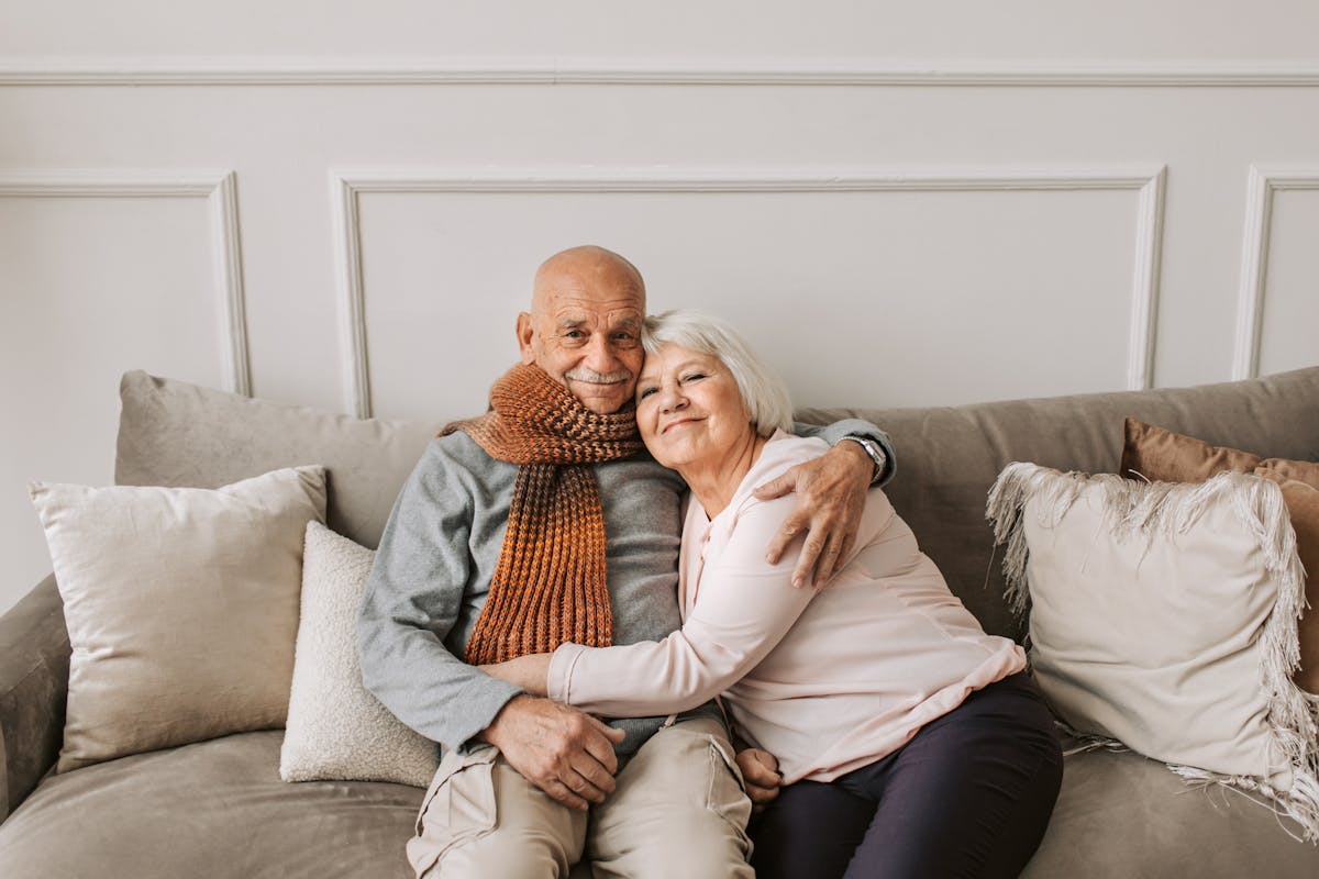 Man and Woman Sitting on Couch