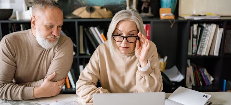 Elderly People Looking at the Monitor of a Laptop